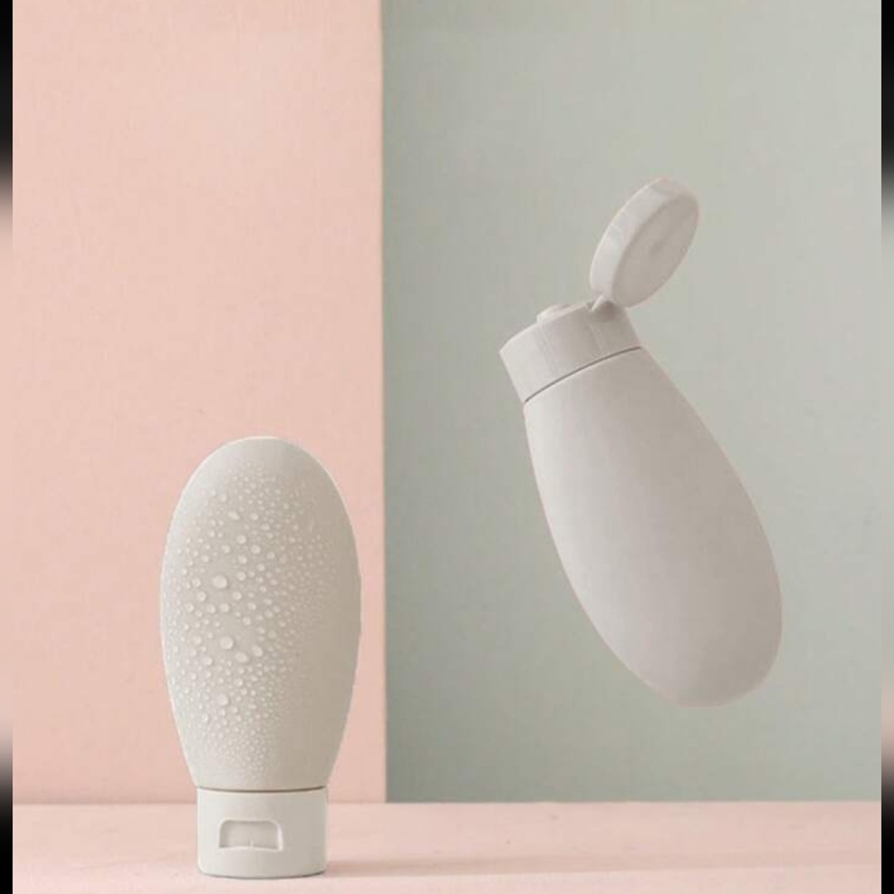 Refillable lotion bottle